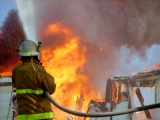 Firefighter battling blaze