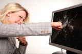 Woman punches computer screen